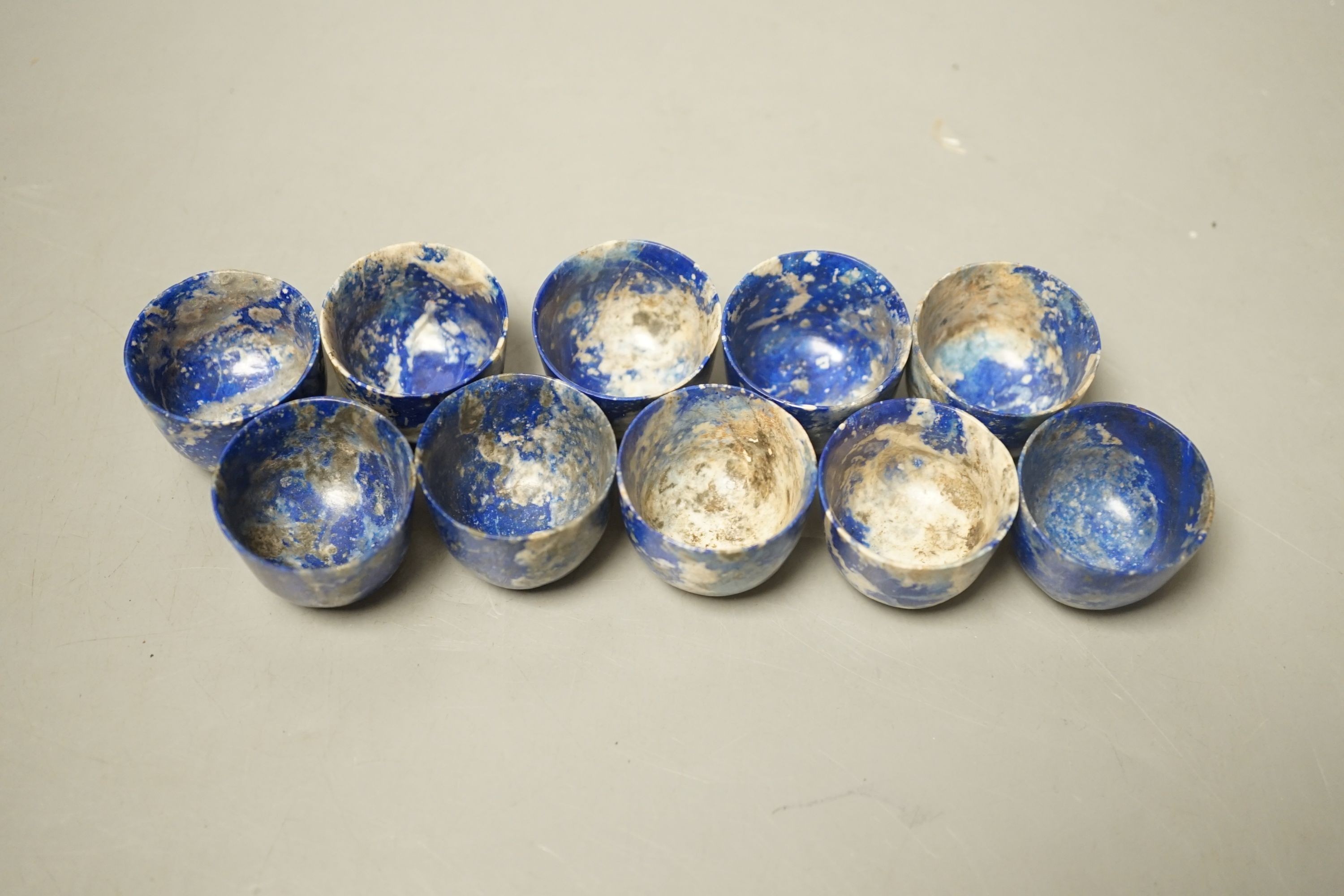 A set of ten Chinese lapis lazuli cups, 2.5cm tall